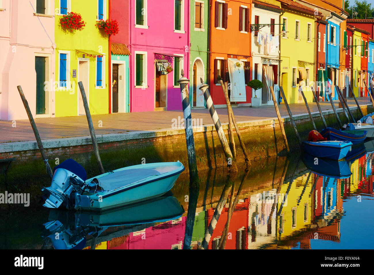 Vibrant colours of terrace of canalside houses at dawn Burano Venetian Lagoon Veneto Italy Europe Stock Photo