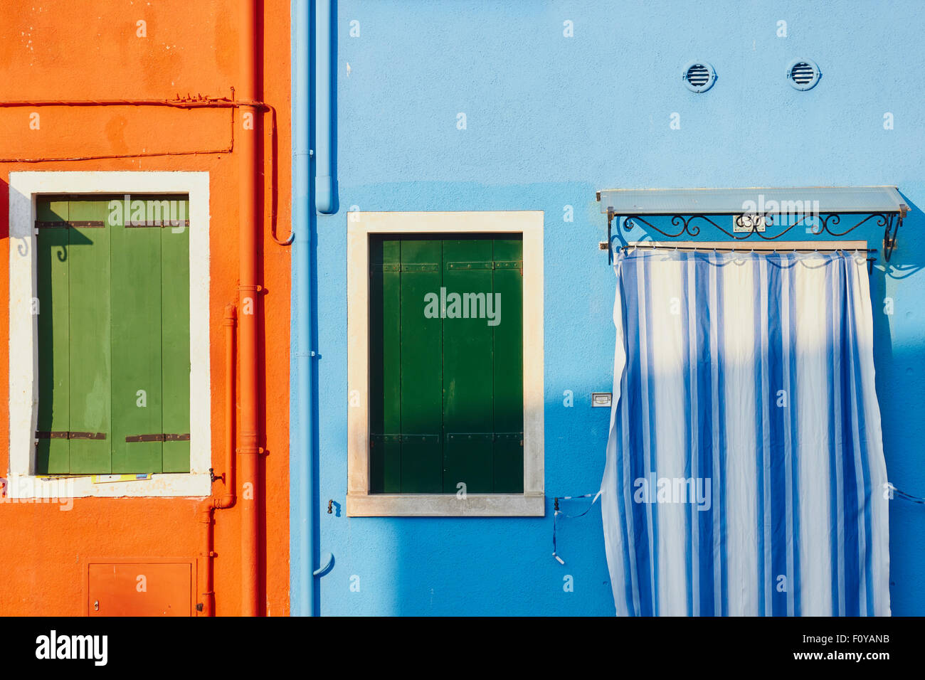 Pipes striped curtain and shutters Burano Venetian Lagoon Veneto Italy Europe Stock Photo