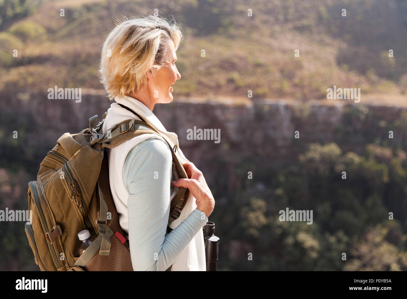 happy senior female hiker enjoying outdoor activity Stock Photo