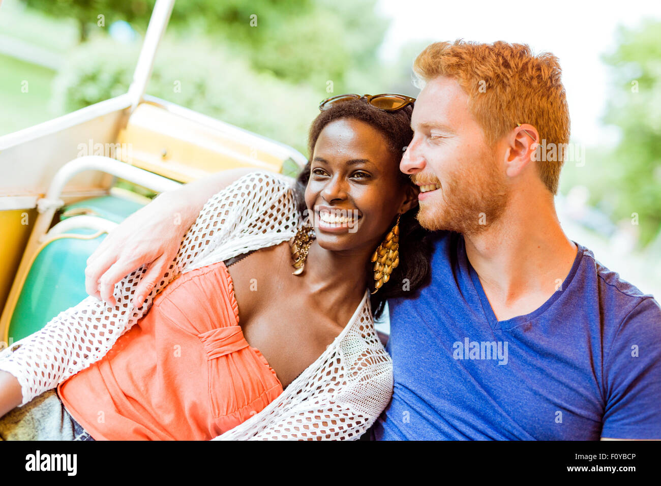 Couple in love traveling by a scenic railway and being happy outdoors Stock Photo