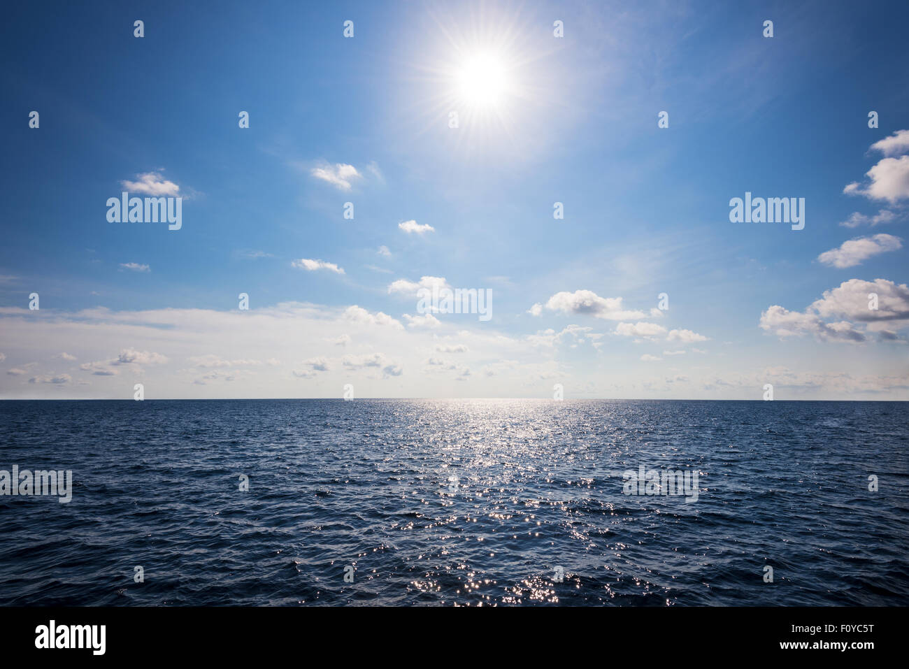 Beautiful landscape of sun on blue sky over the ocean middle Andaman Sea in summer at Mu Koh Similan National Park, Phang Nga Stock Photo