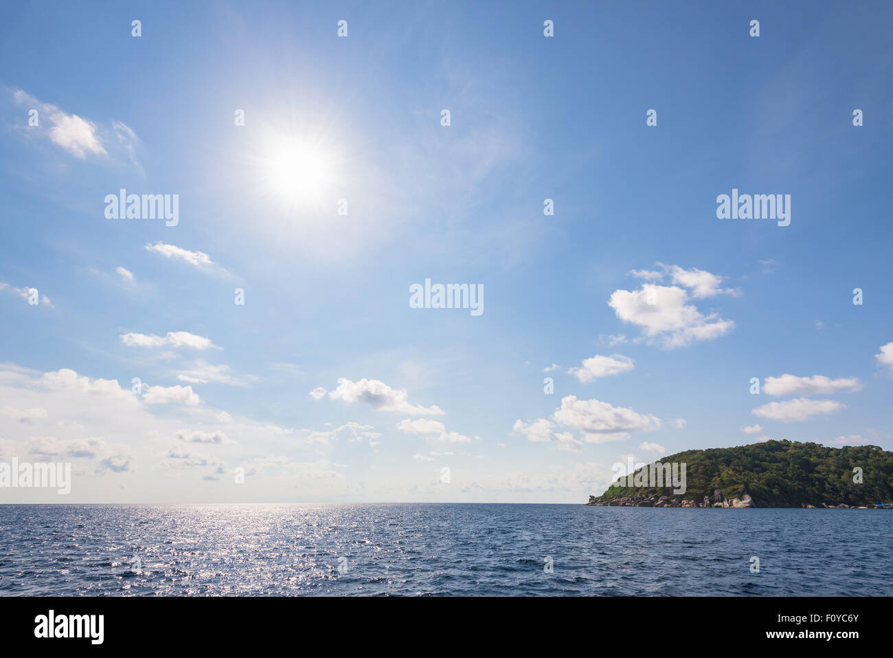Beautiful landscape of sun on blue sky over the sea in summer at Mu Koh Similan National Park, Phang Nga Province, Thailand Stock Photo