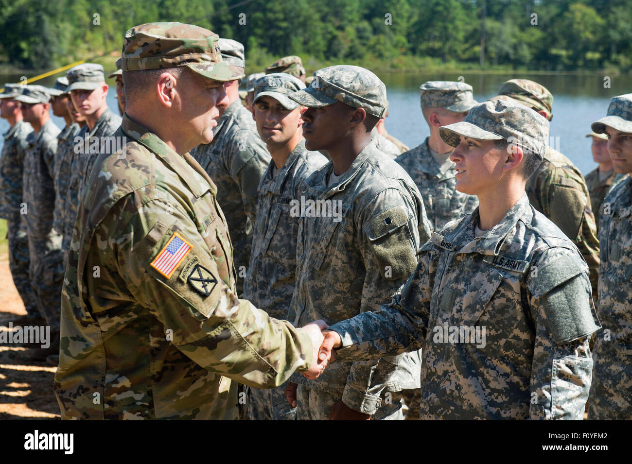 U.S. Army Captain Kristen Griest is congratulated by Army Chief of Staff Gen. Mark A. Milley after becoming the first woman to graduate from Army Ranger school August 21, 2015 at Fort Benning, Georgia. Griest and fellow soldier 1st Lt. Shaye Haver became the first women to graduate from the 61-day-long Ranger course considered one of the most intense and demanding in the military. Stock Photo