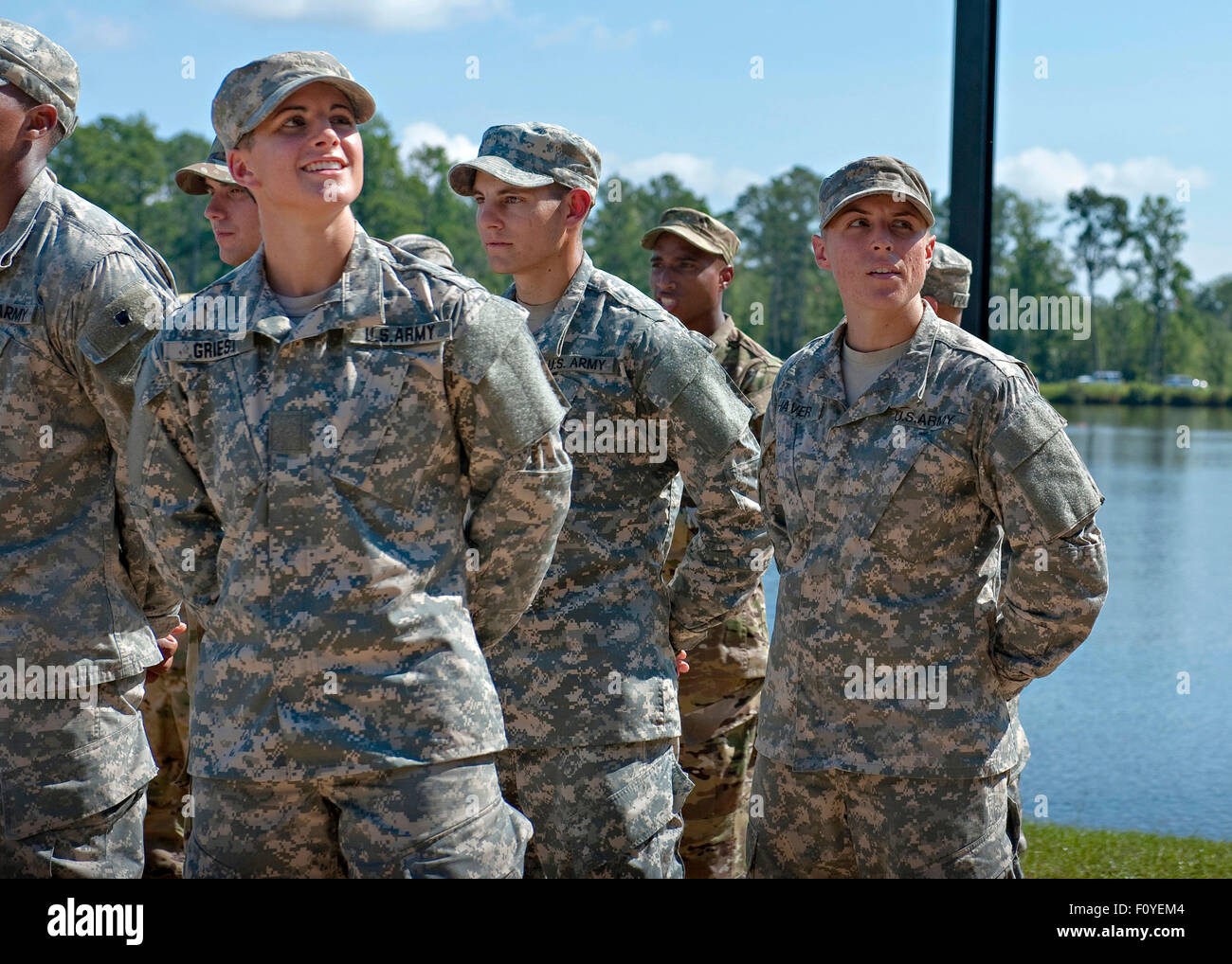 U.S. Army Captain Kristen Griest, left, and fellow soldier 1st Lt. Shaye Haver look toward cheering friends after becoming the first women to graduate from Army Ranger school August 21, 2015 at Fort Benning, Georgia. Stock Photo