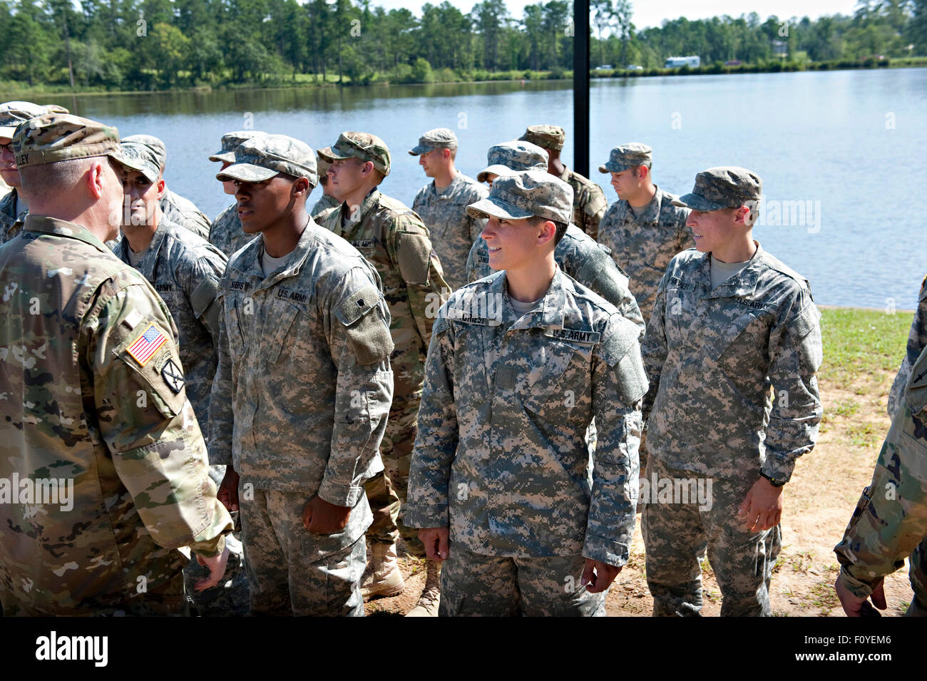 U.S. Army Chief of Staff Gen. Mark A. Milley speaks to soldiers during graduation ceremonies as Captain Kristen Griest looks on August 21, 2015 at Fort Benning, Georgia. Griest and fellow soldier 1st Lt. Shaye Haver became the first women to graduate from the 61-day-long Ranger course considered one of the most intense and demanding in the military. Stock Photo