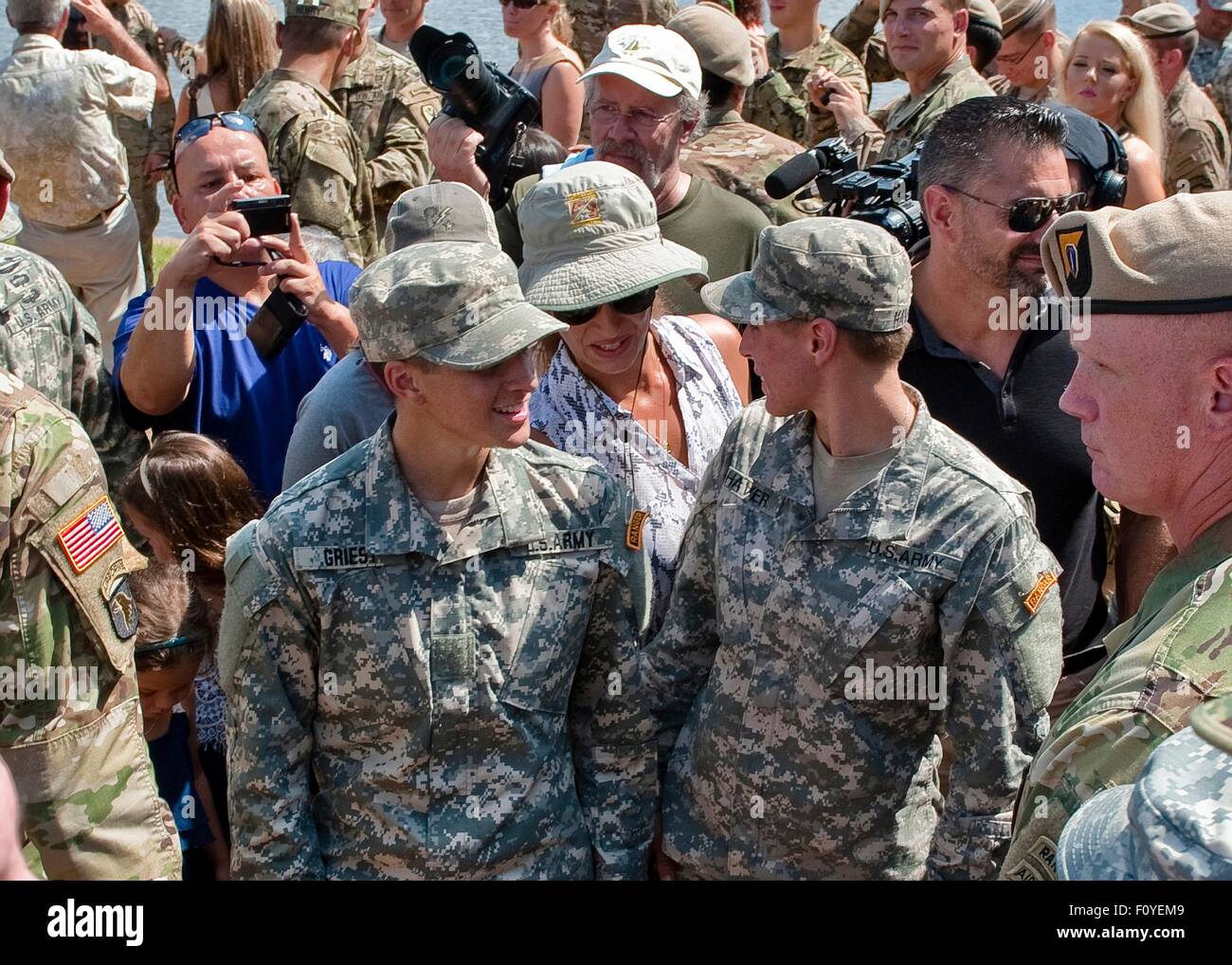 U.S. Army 1st Lt. Shaye Haver, left, and fellow soldier Captain Kristen Griest after graduation ceremonies at the Army Ranger school August 21, 2015 at Fort Benning, Georgia. Haver and fellow soldier 1st Lt. Kristen Griest became the first women to graduate from the 61-day-long Ranger course considered one of the most intense and demanding in the military. Stock Photo