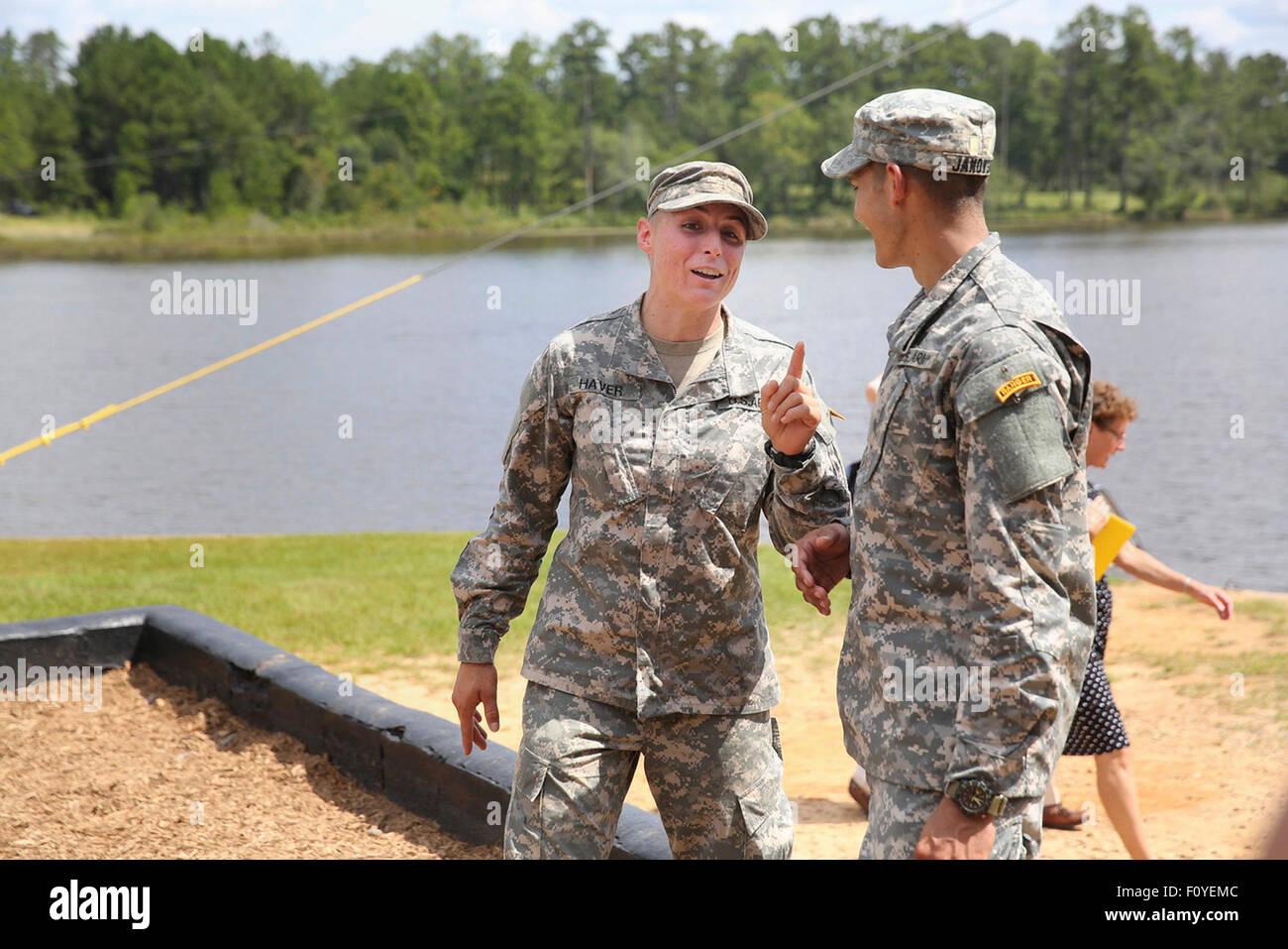 U.S. Army 1st Lt. Shaye Haver jokes with a fellow soldier after graduation ceremonies at the Army Ranger school August 21, 2015 at Fort Benning, Georgia. Haver and fellow soldier Captain Kristen Griest became the first women to graduate from the 61-day-long Ranger course considered one of the most intense and demanding in the military. Stock Photo