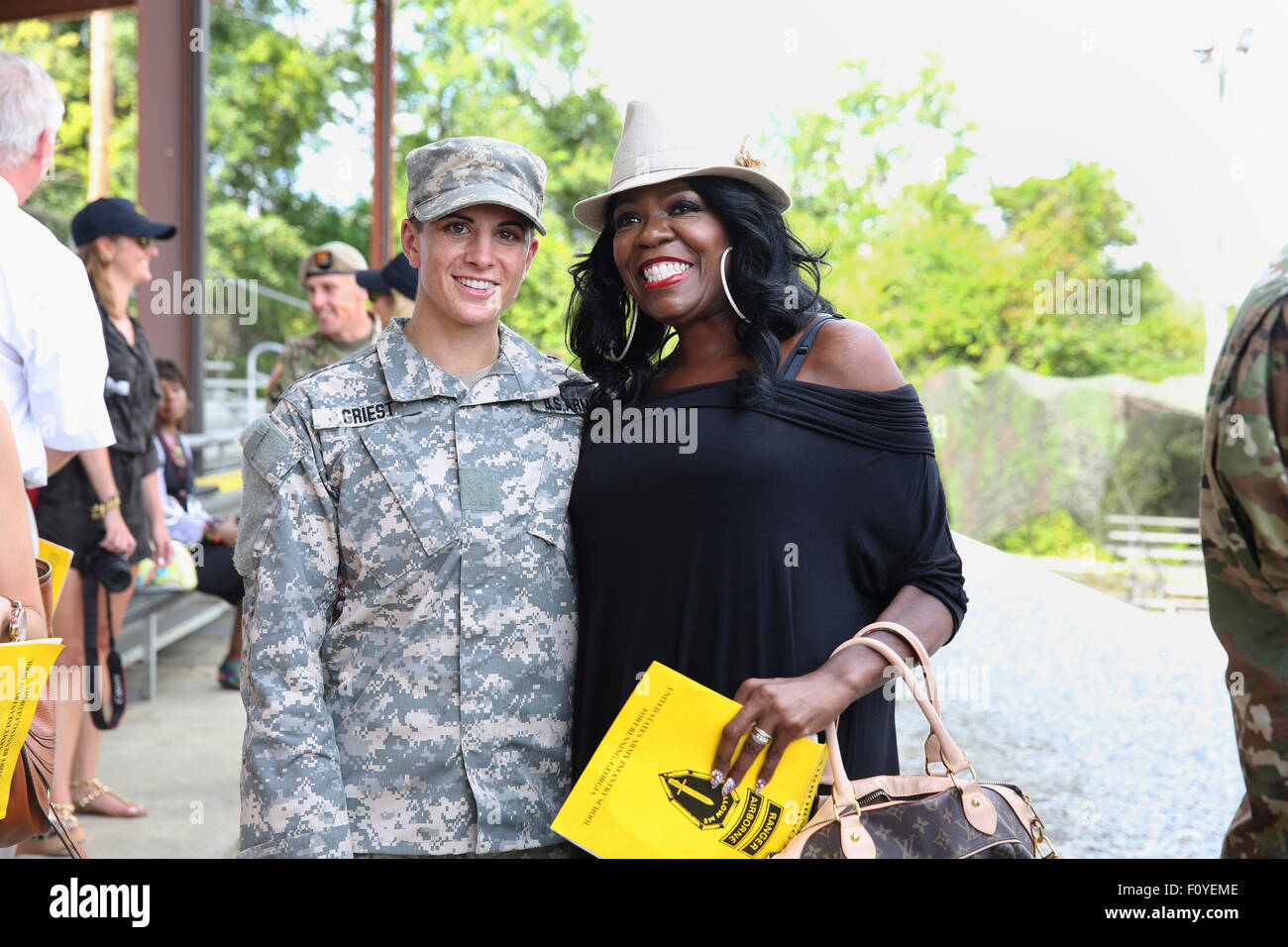 U.S. Army Captain Kristen Griest poses with a friend after graduation ceremonies at the Army Ranger school August 21, 2015 at Fort Benning, Georgia. Griest and fellow soldier 1st Lt. Shaye Haver became the first women to graduate from the 61-day-long Ranger course considered one of the most intense and demanding in the military. Stock Photo