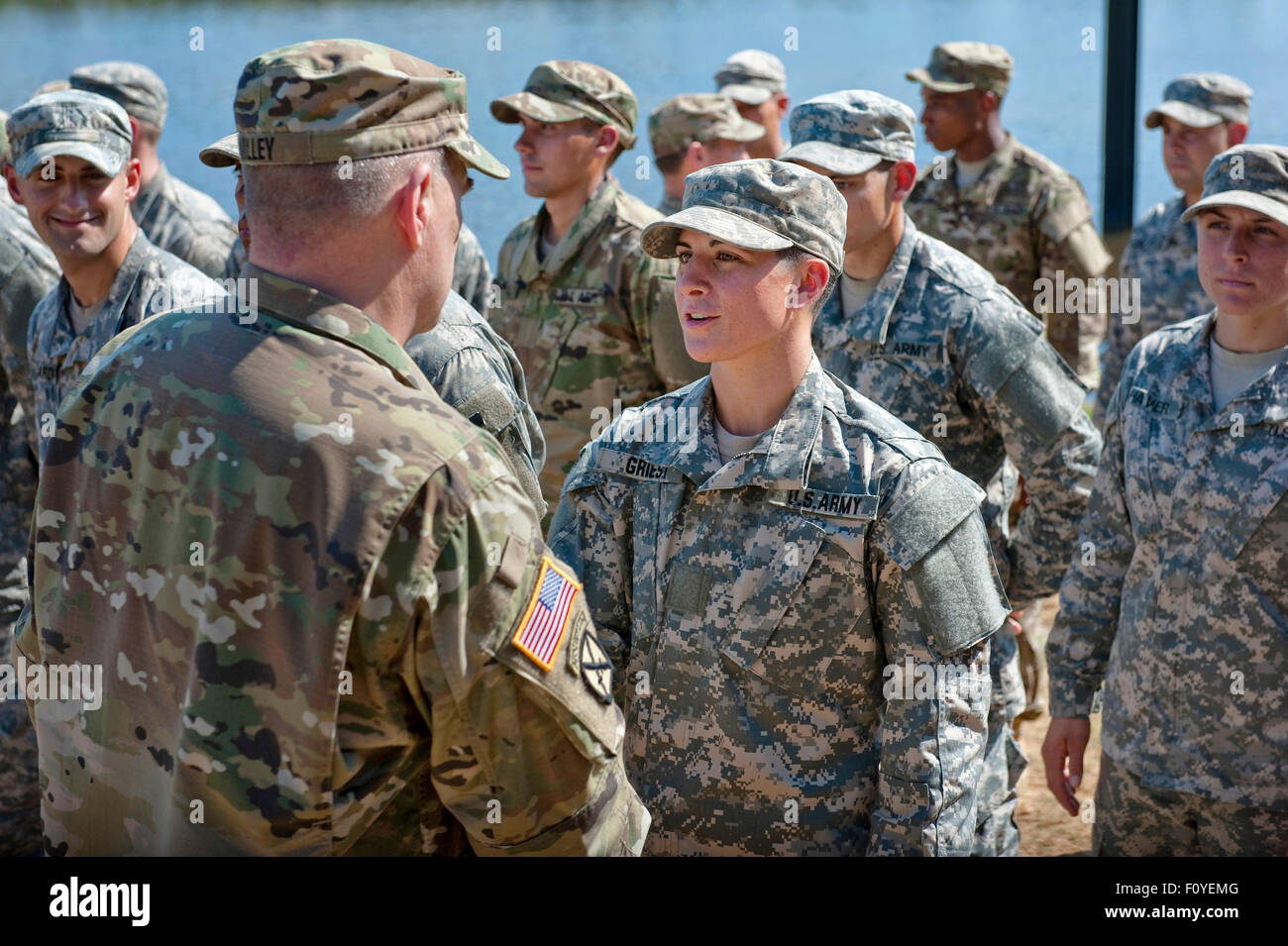 U.S. Army Captain Kristen Griest is congratulated by Army Chief of Staff Gen. Mark A. Milley after becoming the first woman to graduate from Army Ranger school August 21, 2015 at Fort Benning, Georgia. Griest and fellow soldier 1st Lt. Shaye Haver became the first women to graduate from the 61-day-long Ranger course considered one of the most intense and demanding in the military. Stock Photo