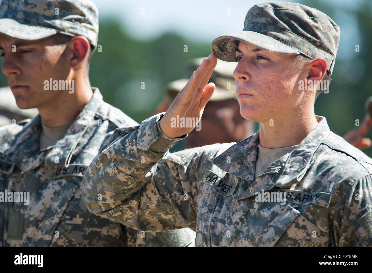 U.S. Army 1st Lt. Shaye Haver salutes during graduation ceremonies at the Army Ranger school August 21, 2015 in Fort Benning, Georgia. Haver and fellow soldier Captain Kristen Griest became the first women to graduate from the 61-day-long Ranger course considered one of the most intense and demanding in the military. Stock Photo
