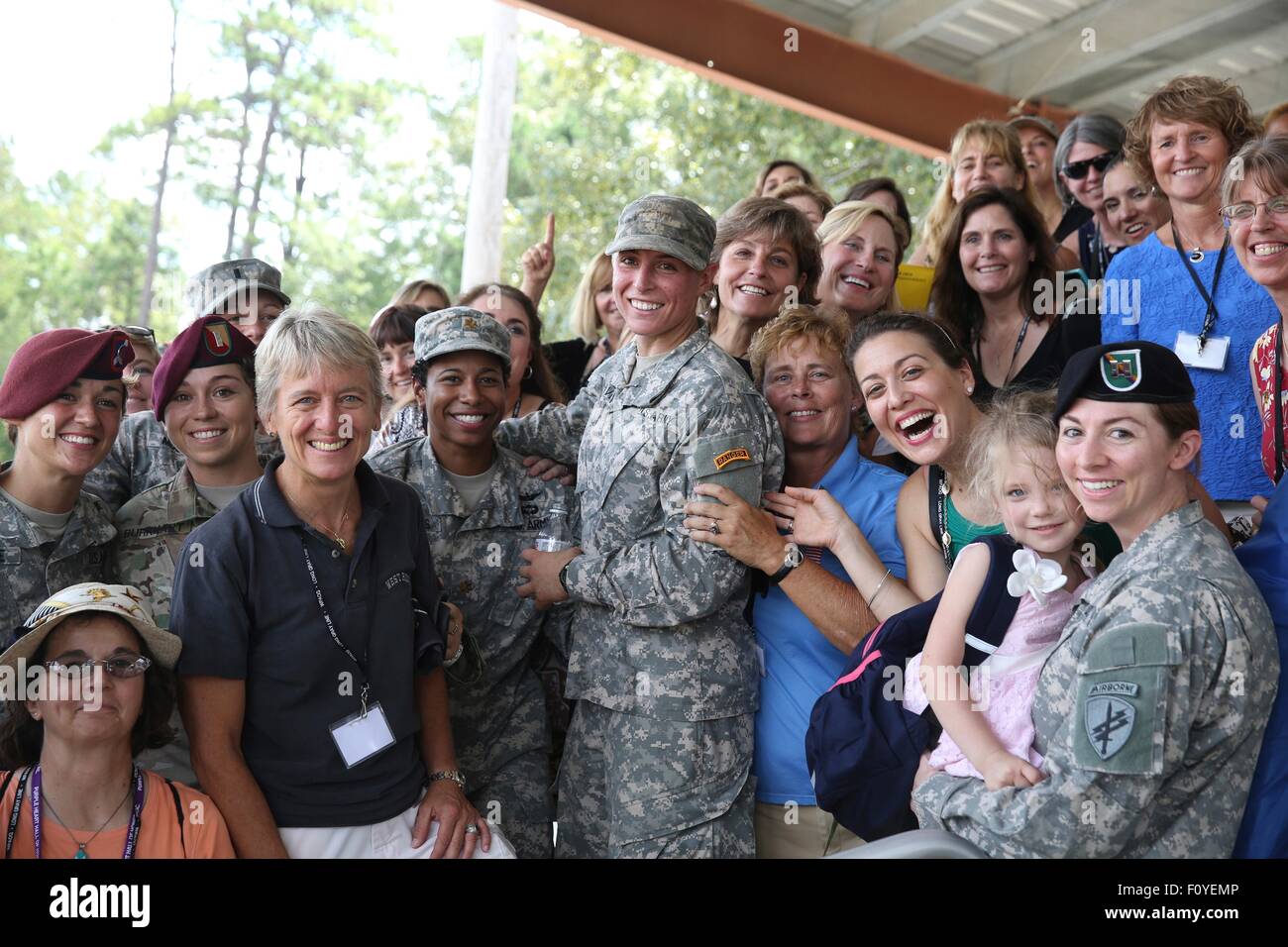U.S. Army 1st Lt. Shaye Haver, center, poses for photos with female West Point alumni after becoming the first woman to graduate from Army Ranger school August 21, 2015 at Fort Benning, Georgia. Stock Photo