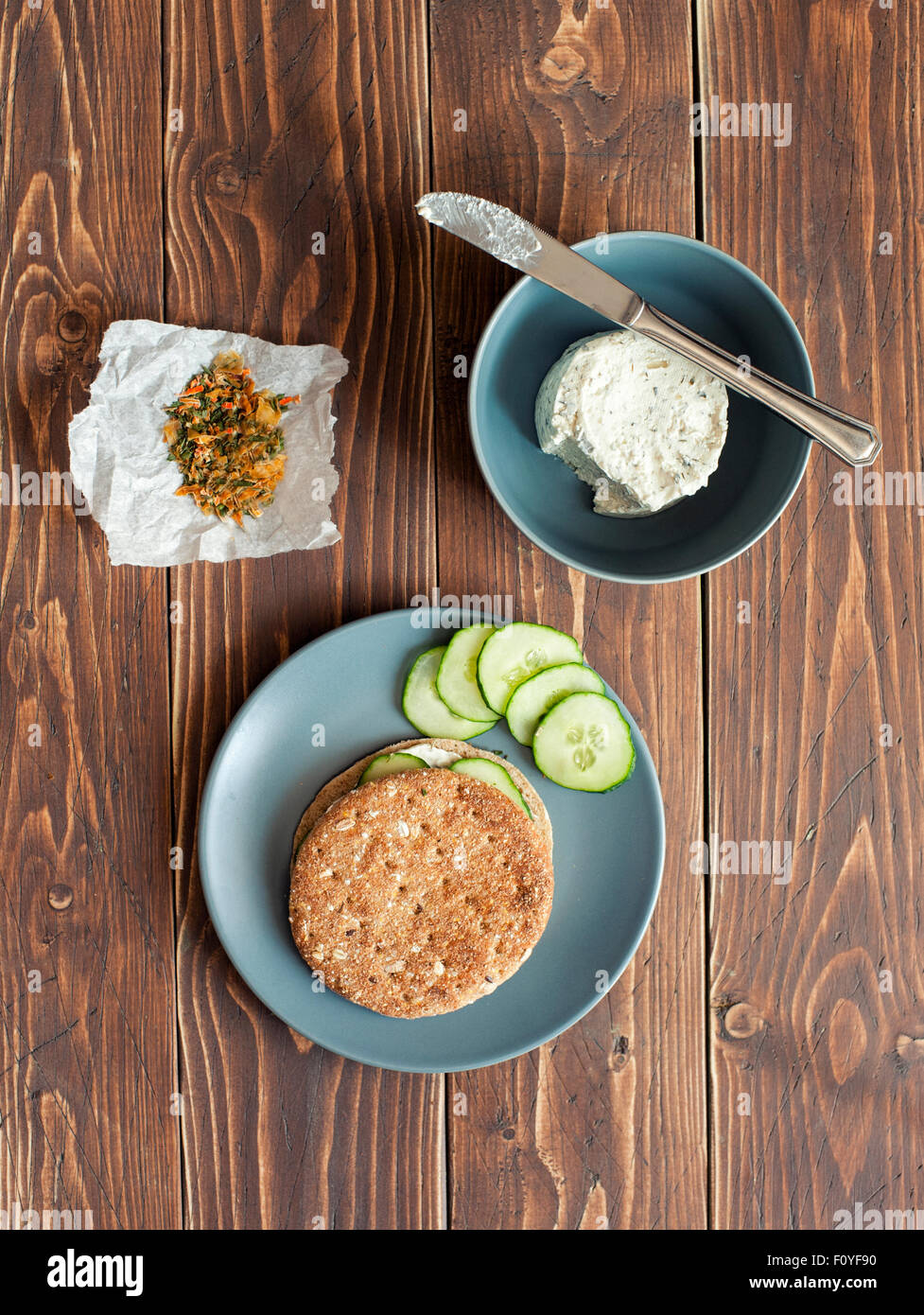 Sandwich with cheese and fresh cucumbers on the wooden background Stock Photo