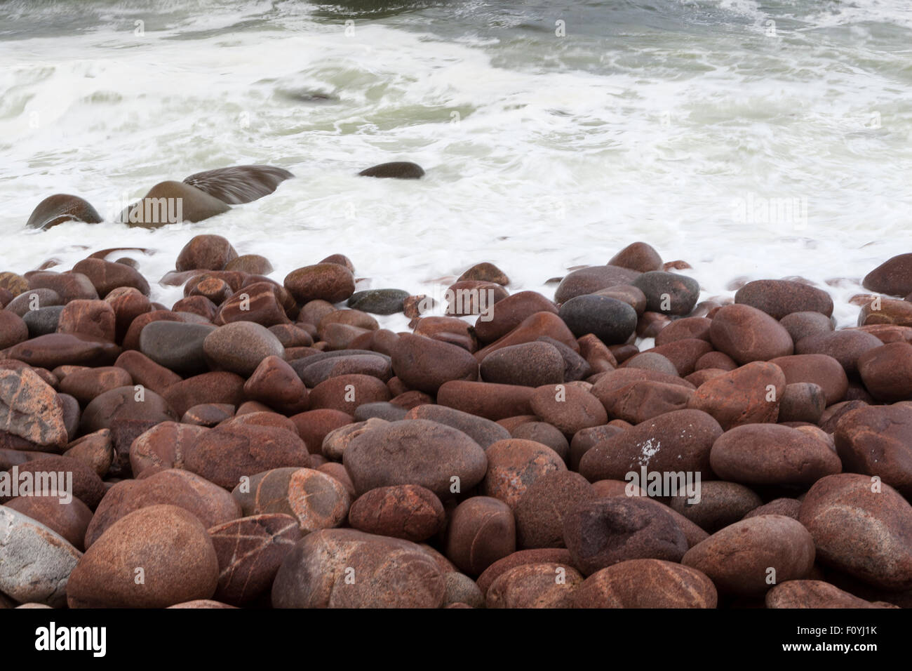 Cobblestones beach in Cape Breton, Nova Scotia Stock Photo