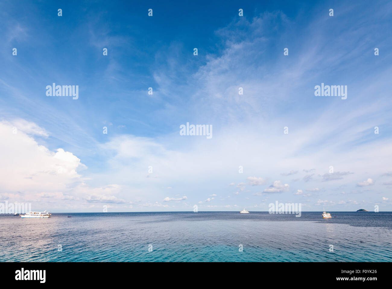 Background blue sky and cloud in summer over Andaman Sea at Honeymoon Bay in Mu Koh Similan island National Park, Phang Nga Prov Stock Photo