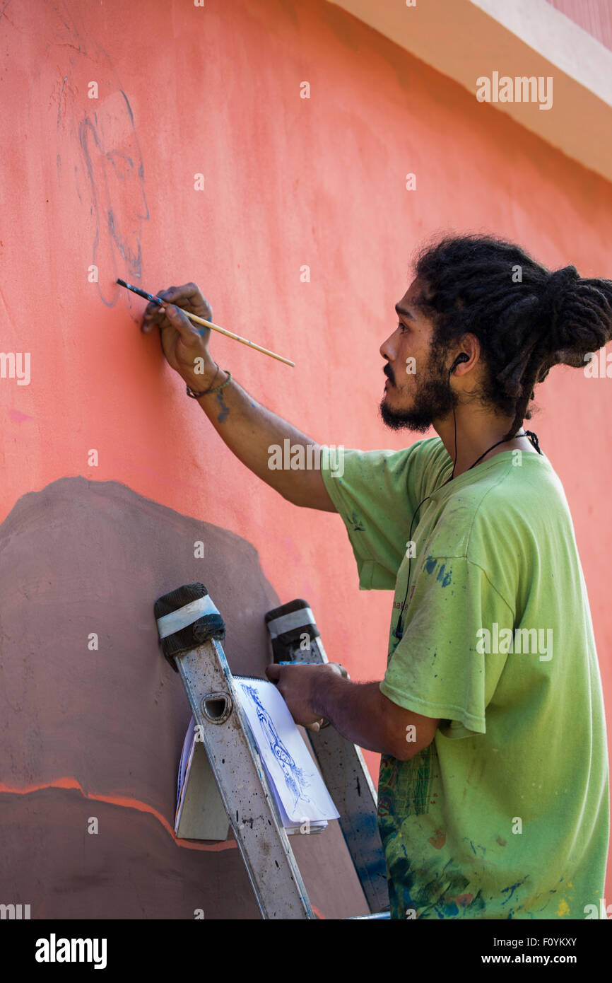 Street artist painting in Valparaiso, Chile Stock Photo