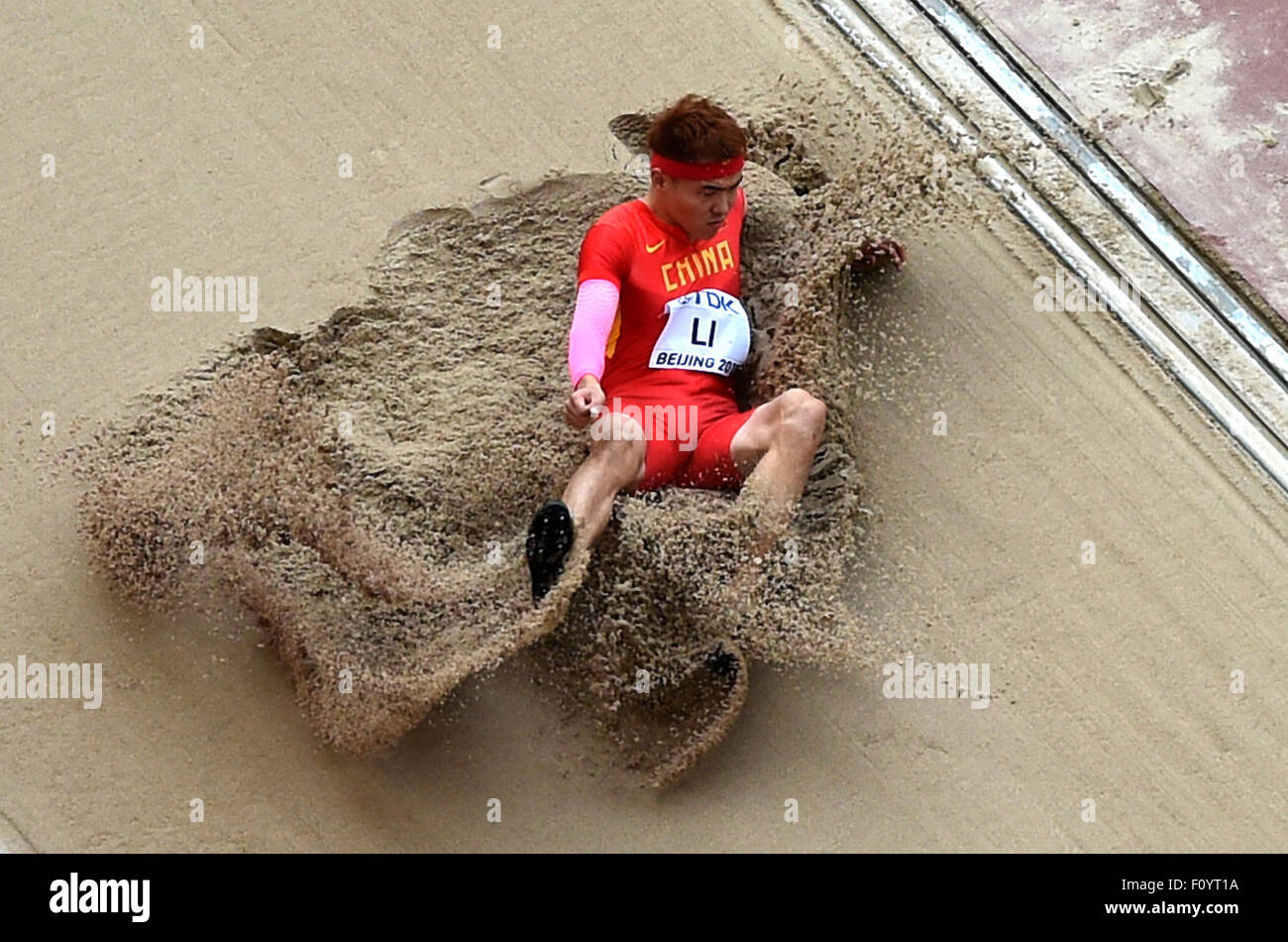Beijing, China. 24th Aug, 2015. China's Li Jinzhe competes in the heats of the men's long jump at the 2015 IAAF World Championships at the 'Bird's Nest' National Stadium in Beijing, capital of China, Aug. 24, 2015. Credit:  Li Gang/Xinhua/Alamy Live News Stock Photo