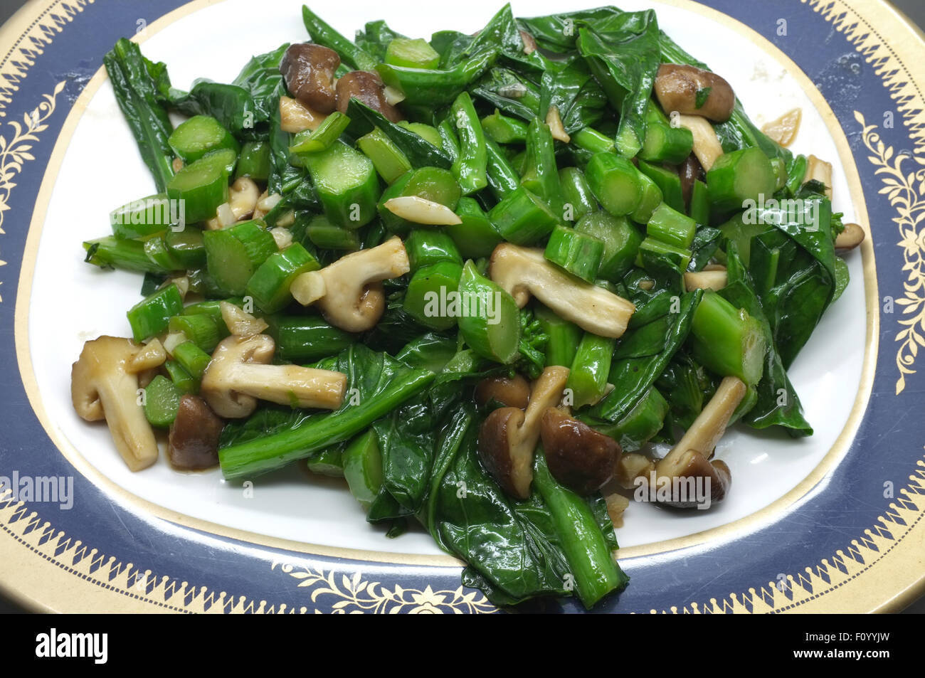 Stir fried green kale and mushroom Stock Photo