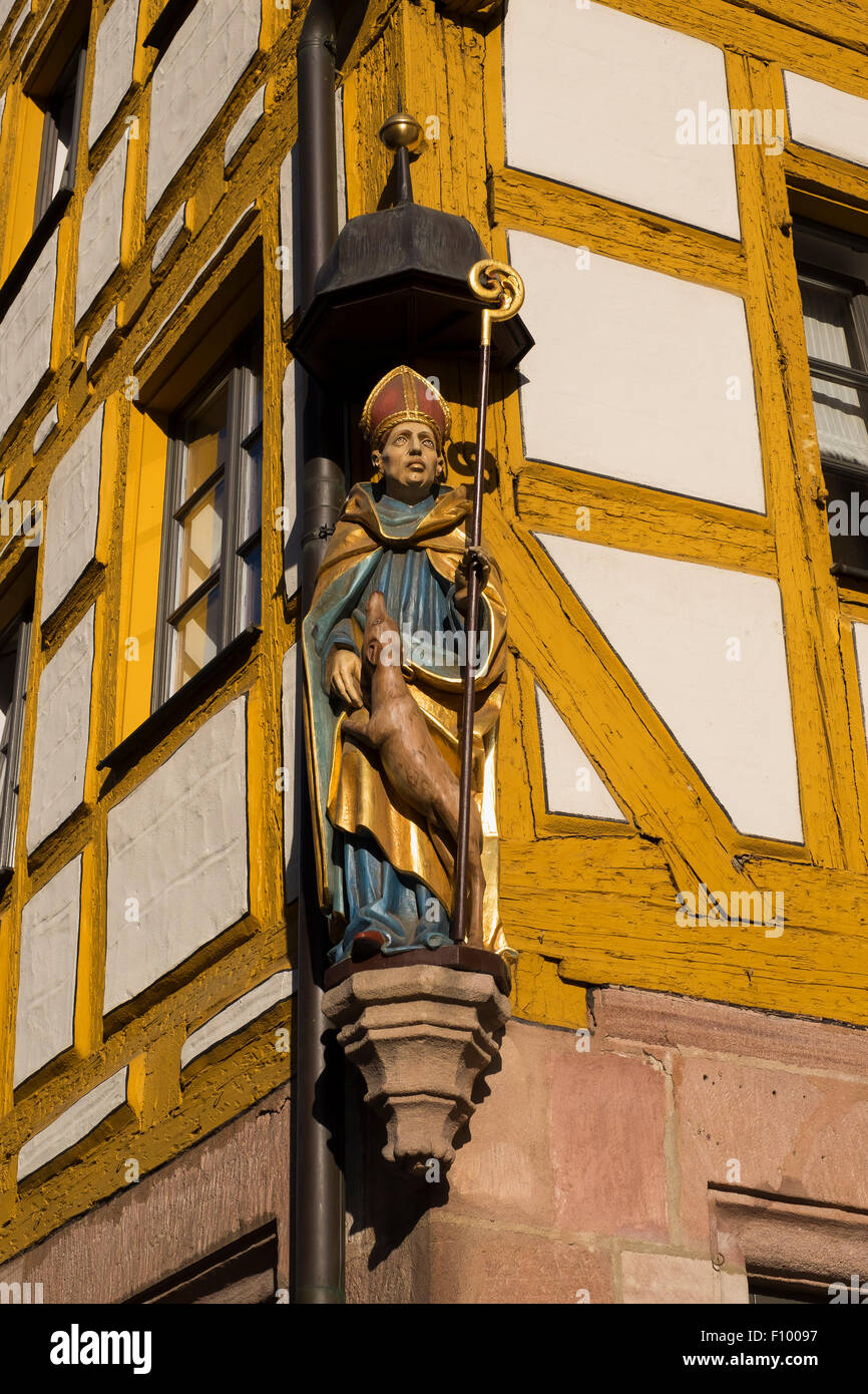 Figure Saint Giles on an old half-timbered house in the Weißgerbergasse, Sebalder Altstadt, Nuremberg, Middle Franconia Stock Photo