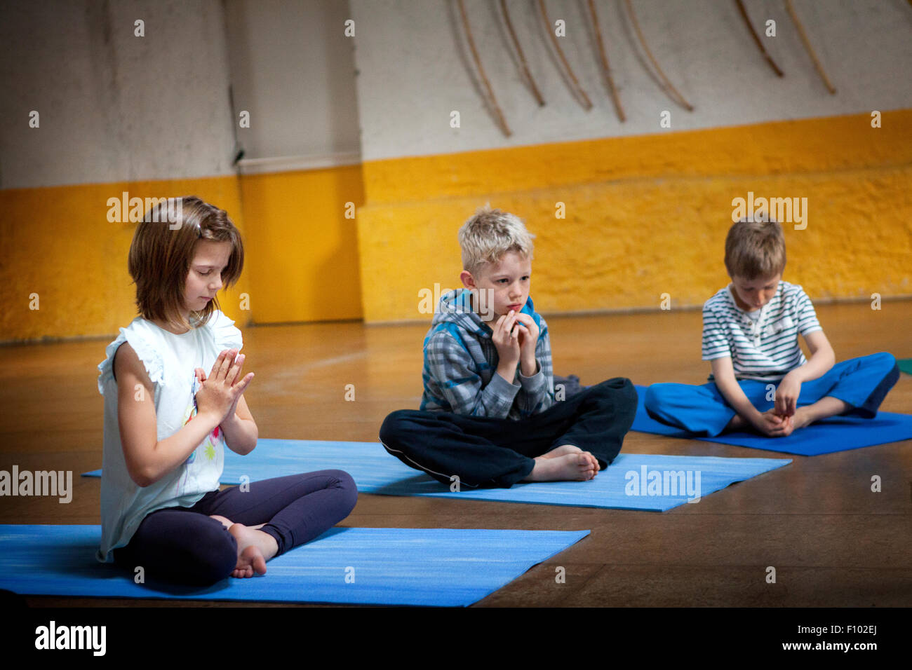 CHILD PRACTICING YOGA Stock Photo