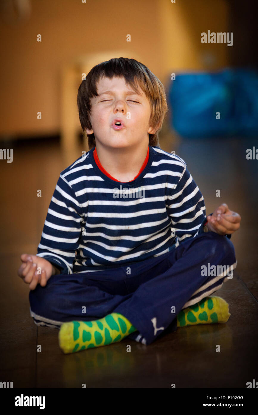 CHILD PRACTICING YOGA Stock Photo - Alamy
