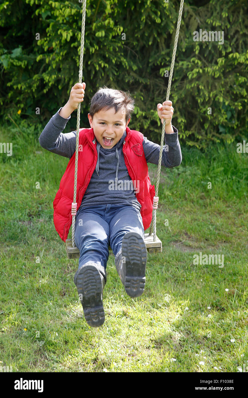 CHILD PLAYING OUTDOORS Stock Photo