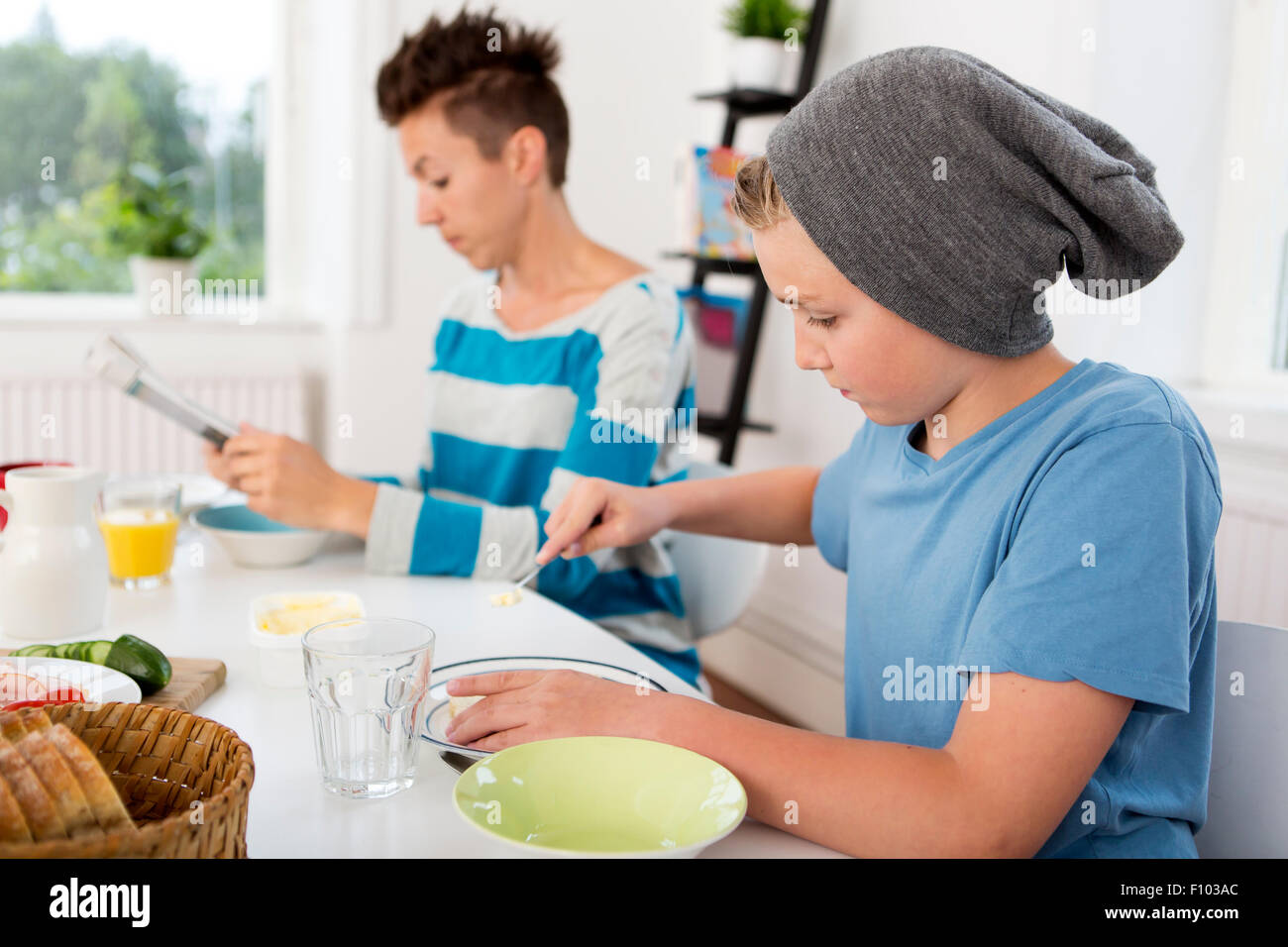 Mother and son having breakfast together in the morning Stock Photo