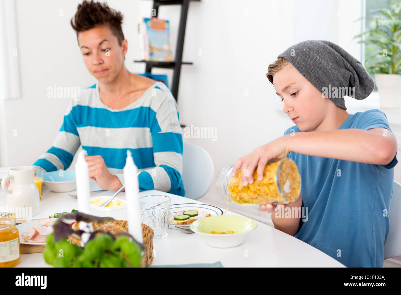 Mother and son having breakfast together in the morning Stock Photo