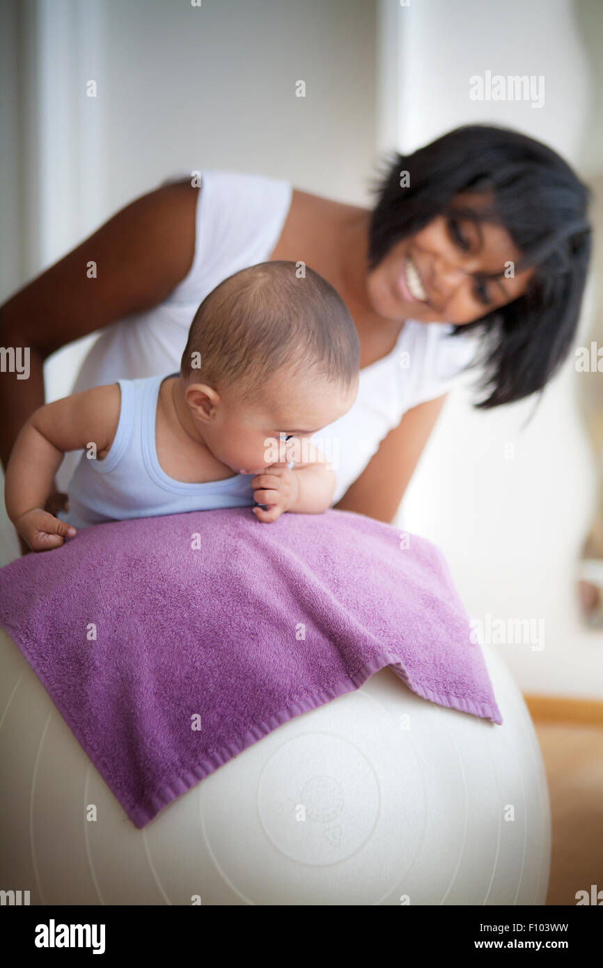 INFANT BEING MASSAGED Stock Photo