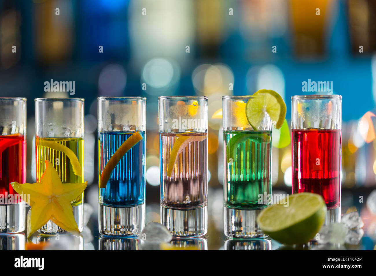 Colored alcoholic shots on bar counter Stock Photo
