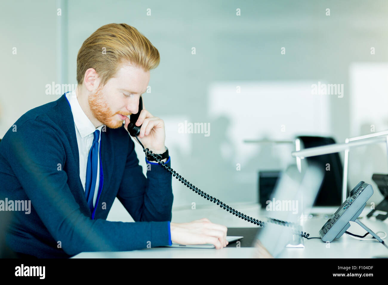 A Handsome Male Red Haired Worker In A Call Center Office Talking