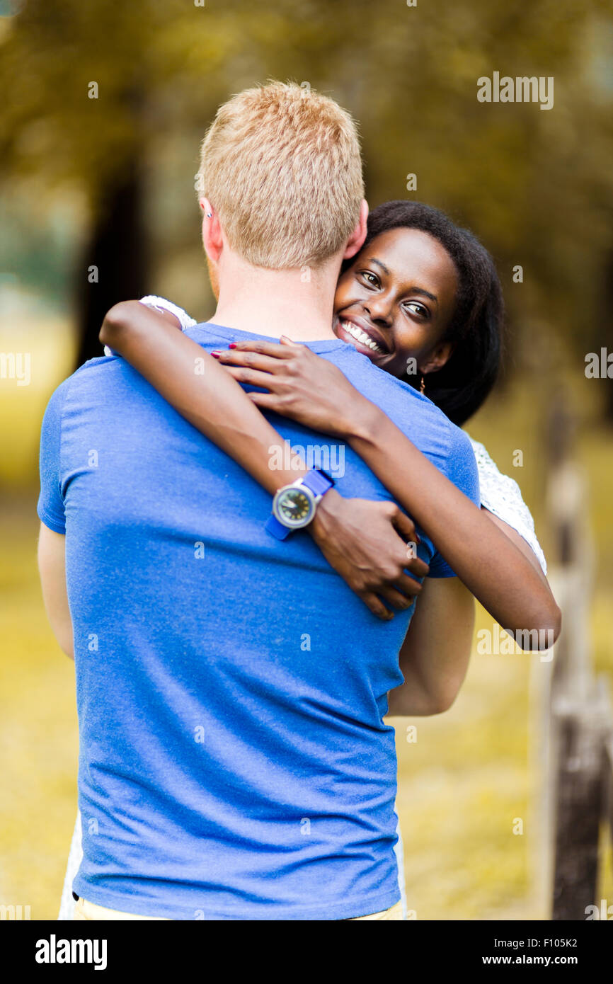 Couple in love hugging peacefully outdoors and being truly happy. Feeling of security and serenity Stock Photo