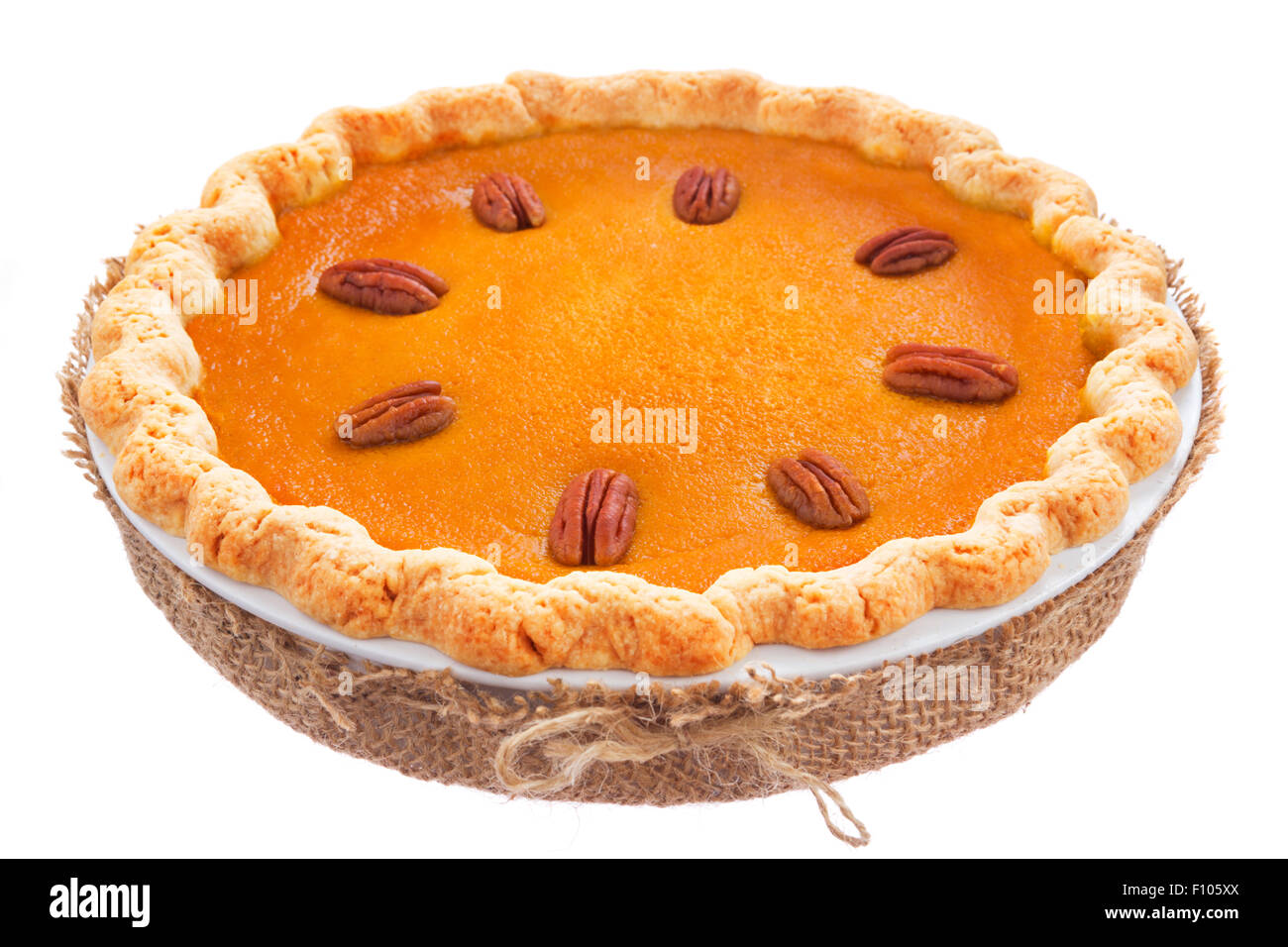 A delicious rustic homemade pumpkin pie isolated on a white background. Stock Photo