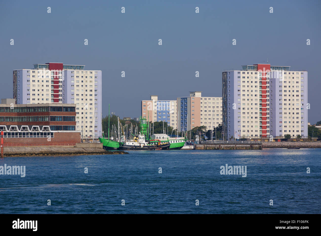 View of the tower blocks on the harbour side in Gosport. View from spice island showing the trinity lightship in center. Stock Photo