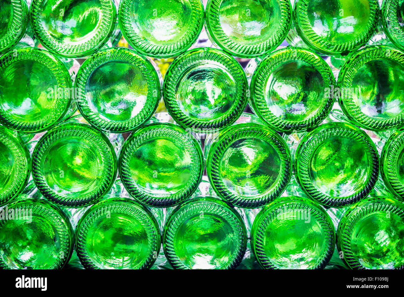 Closeup bottoms of green color bottles background Stock Photo - Alamy