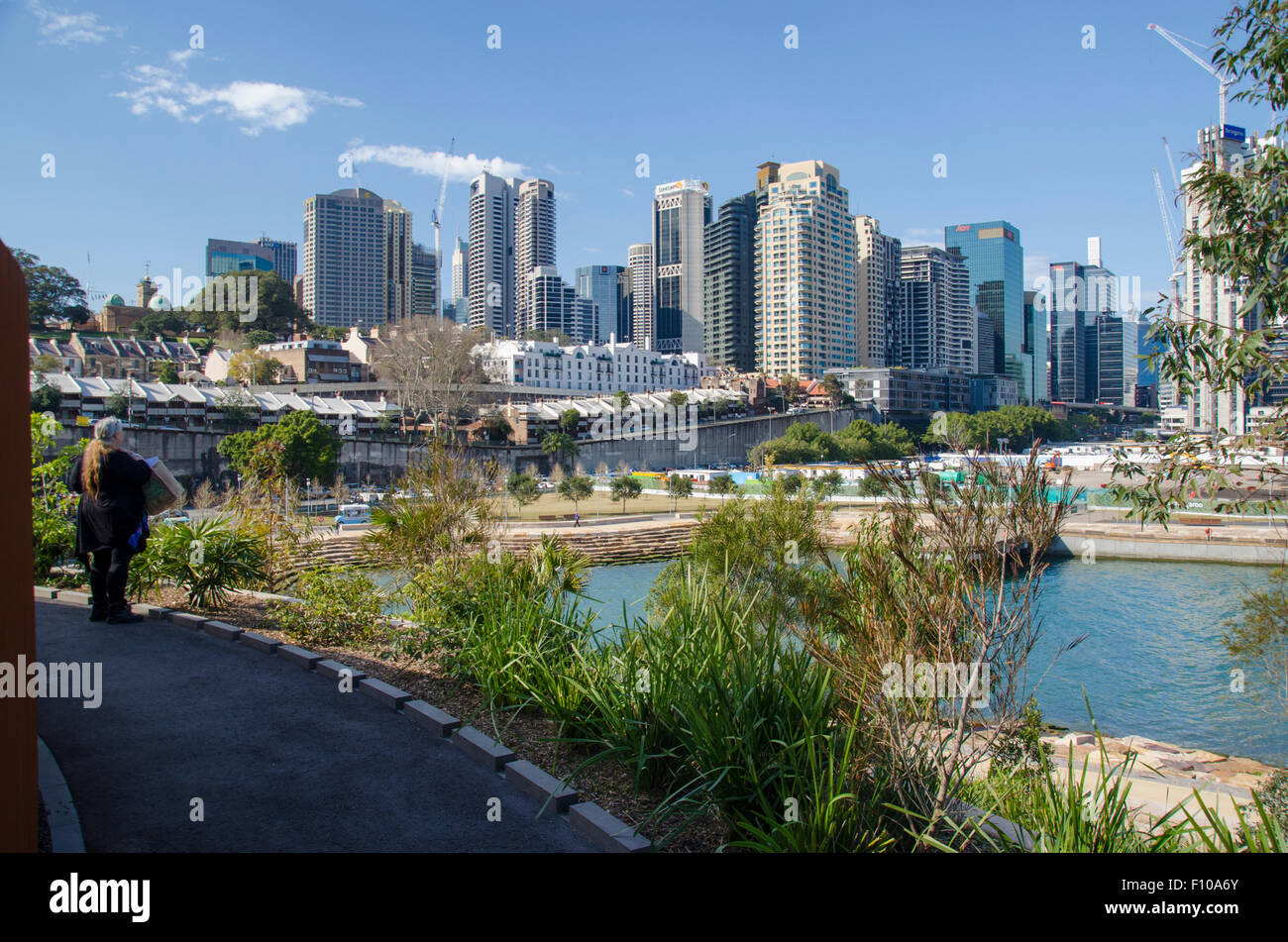 Sydney August 2015 A woman looks back over Nawi Cove towards Sydney