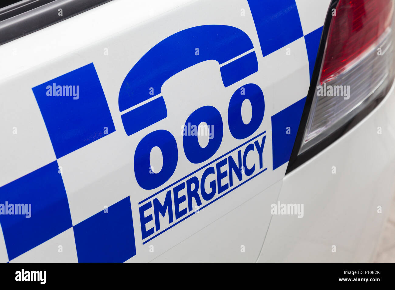 Emergency number 000 on a police car Stock Photo