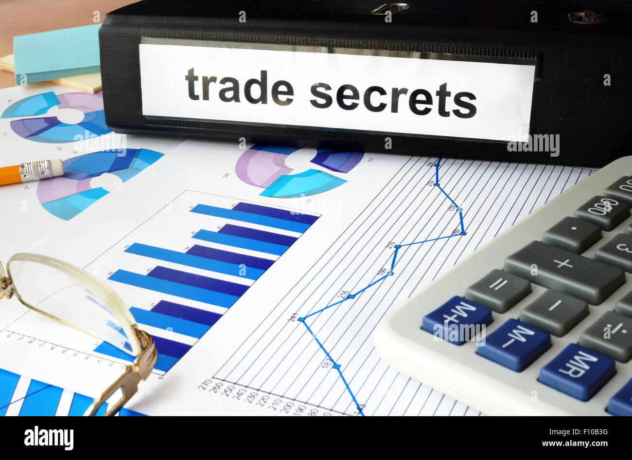 Folder with the label trade secrets and charts. Stock Photo