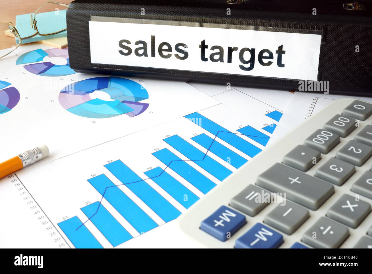 Folder with the label sales target and charts. Stock Photo