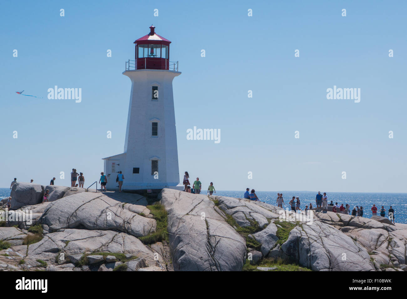 tourists Peggys Cove lighthouse Halifax Nova Scotia Canada Stock Photo