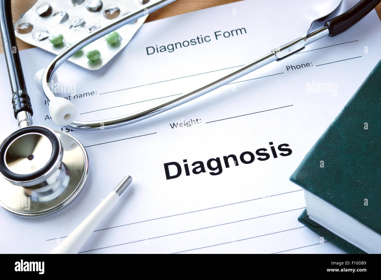Diagnistic form with Diagnosis and stethoscope. Medicine concept. Stock Photo