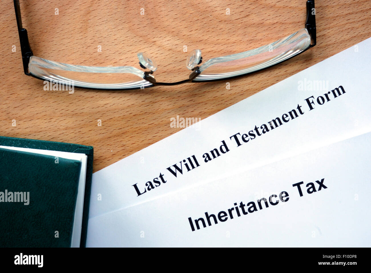 Papers with inheritance tax and testament form Stock Photo