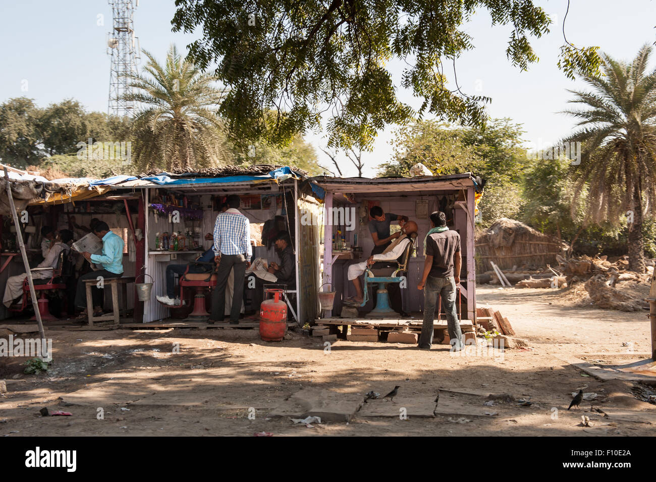 Rajasthan, India. Between Jaipur and Ranthambore. Barbers' kiosks at the roadside. Stock Photo