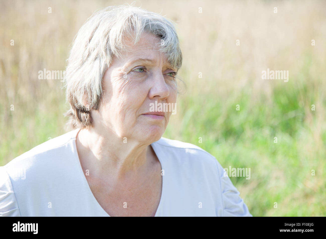 Portrait of a worried old age woman Stock Photo