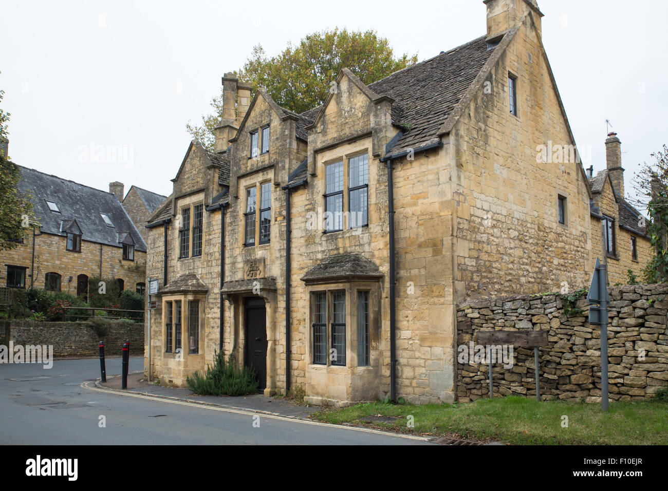 Typical architecture on old stone house in Cotswolds in English countryside Stock Photo