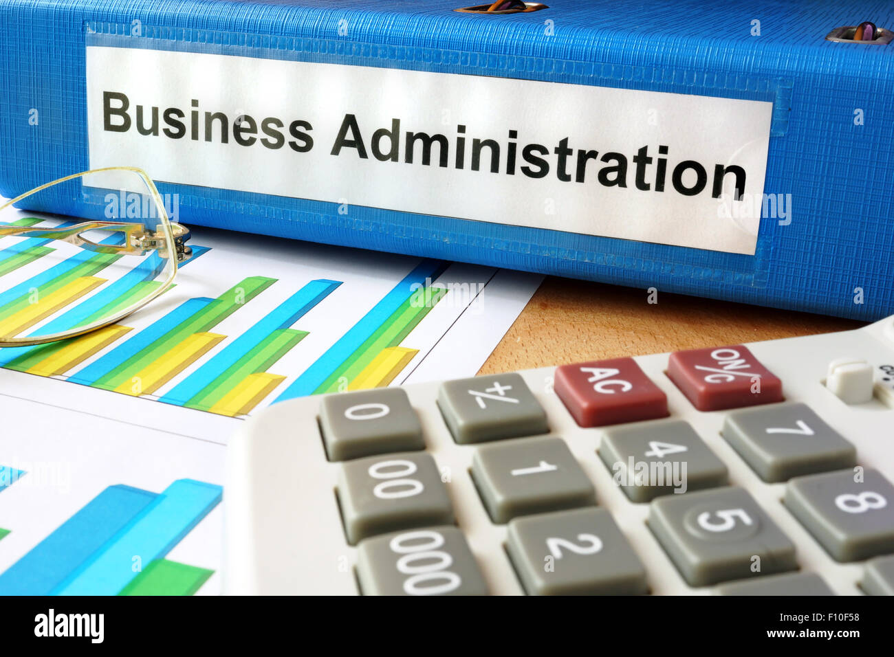 Folder with label business administration and charts. Stock Photo