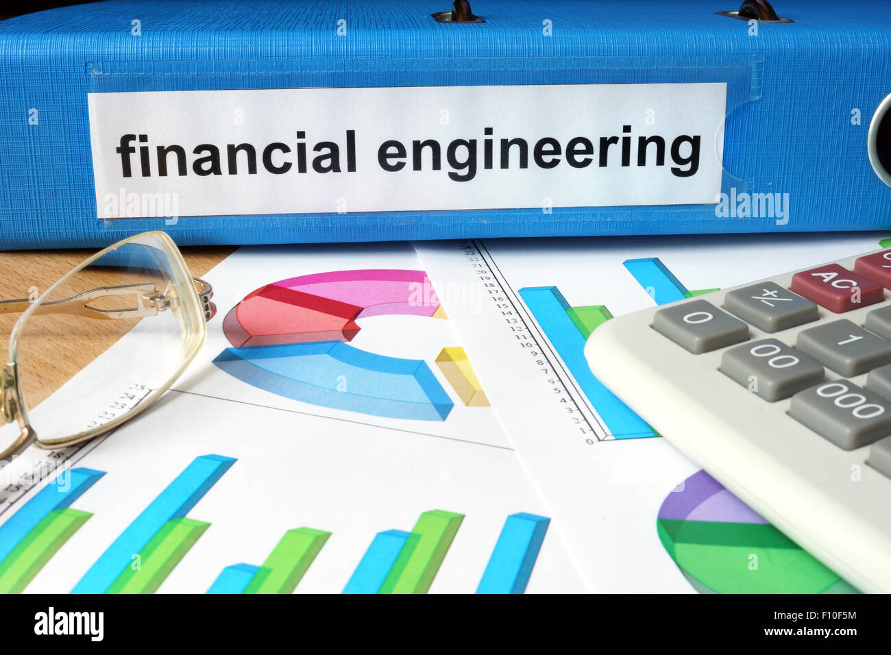 Folder with label financial engineering and charts. Stock Photo
