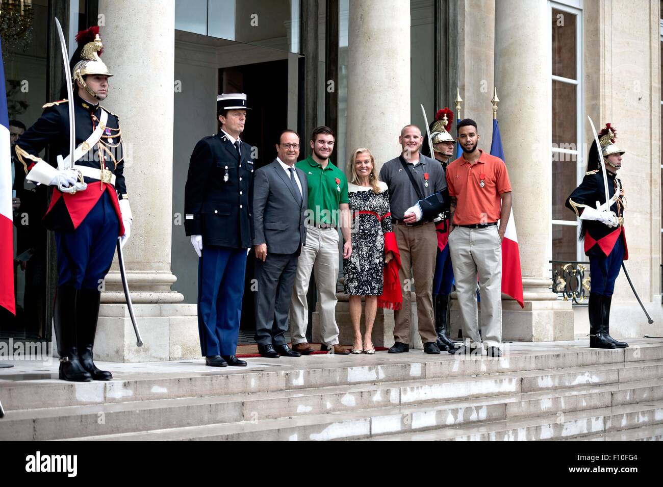 Paris, France. 24th Aug, 2015. (From 3-L to 7-L) French President Francois Hollande poses a photo with Alek Skarlatos, U.S. Ambassador to France Jane D. Hartley, Spencer Stone and Anthony Sadler at the Elysee Palace in Paris, France, Aug. 24, 2015. French President Francois Hollande on Monday awarded France's highest honor, the Legion d'honneur, to three U.S. men and Briton Chris Norman who helped neutralize a shooter at Thalys high-speed train between Amsterdam and Paris last week. Credit:  Andy Louis/Xinhua/Alamy Live News Stock Photo