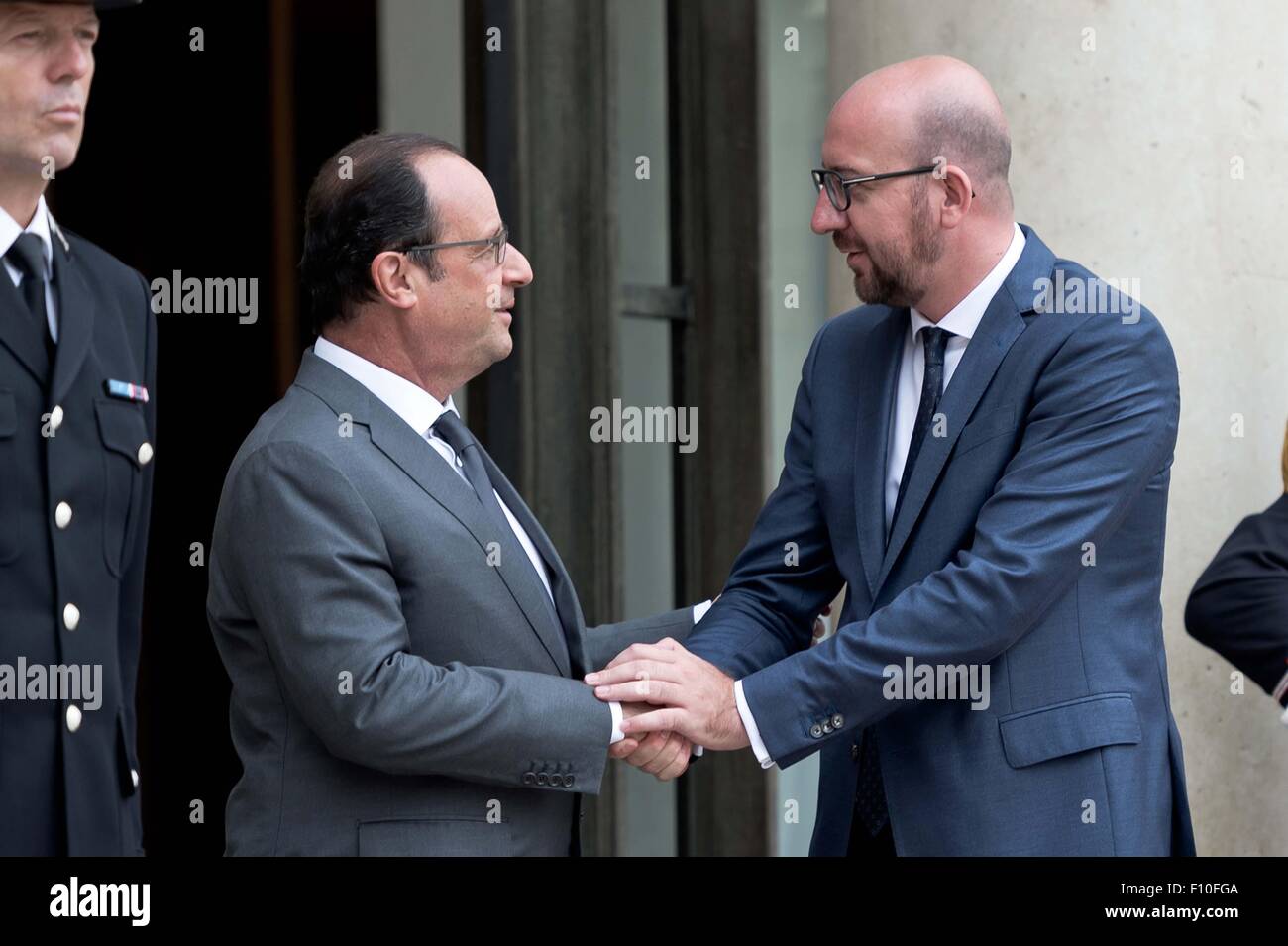 Paris, France. 24th Aug, 2015. French President Francois Hollande (L) welcomes Belgian Prime Minister Charles Michel upon his arrival at the Elysee Palace in Paris, France, Aug. 24, 2015. French President Francois Hollande on Monday awarded France's highest honor, the Legion d'honneur, to three U.S. men, Alek Skarlatos, Spencer Stone and Anthony Sadler and Briton Chris Norman who helped neutralize a shooter at Thalys high-speed train between Amsterdam and Paris last week. Credit:  Andy Louis/Xinhua/Alamy Live News Stock Photo