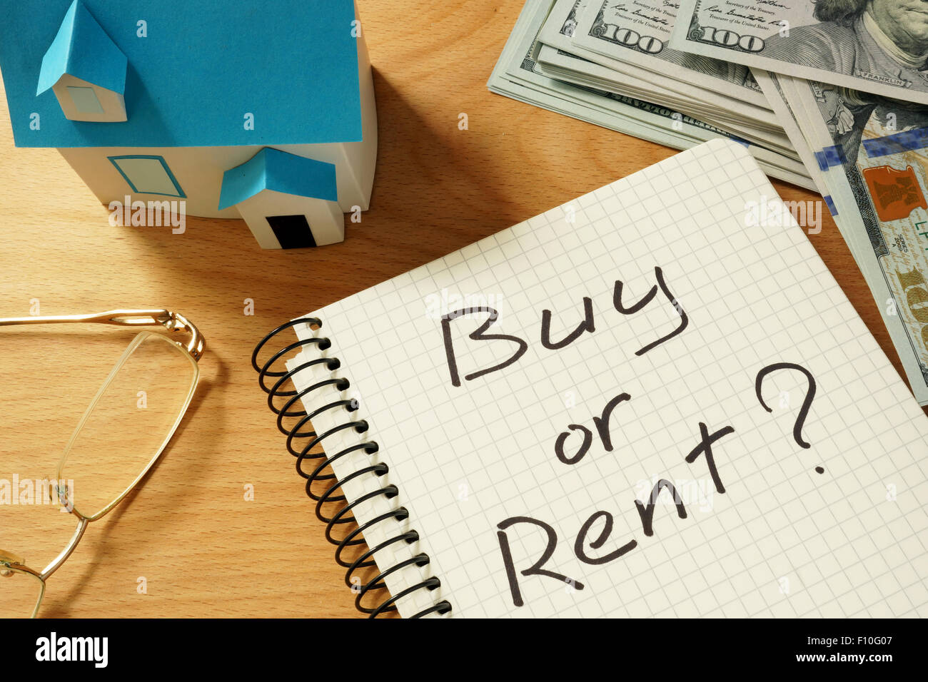 Trade For Rent Real Notepad with buy or rent, home model and dollars. Real estate concept ...