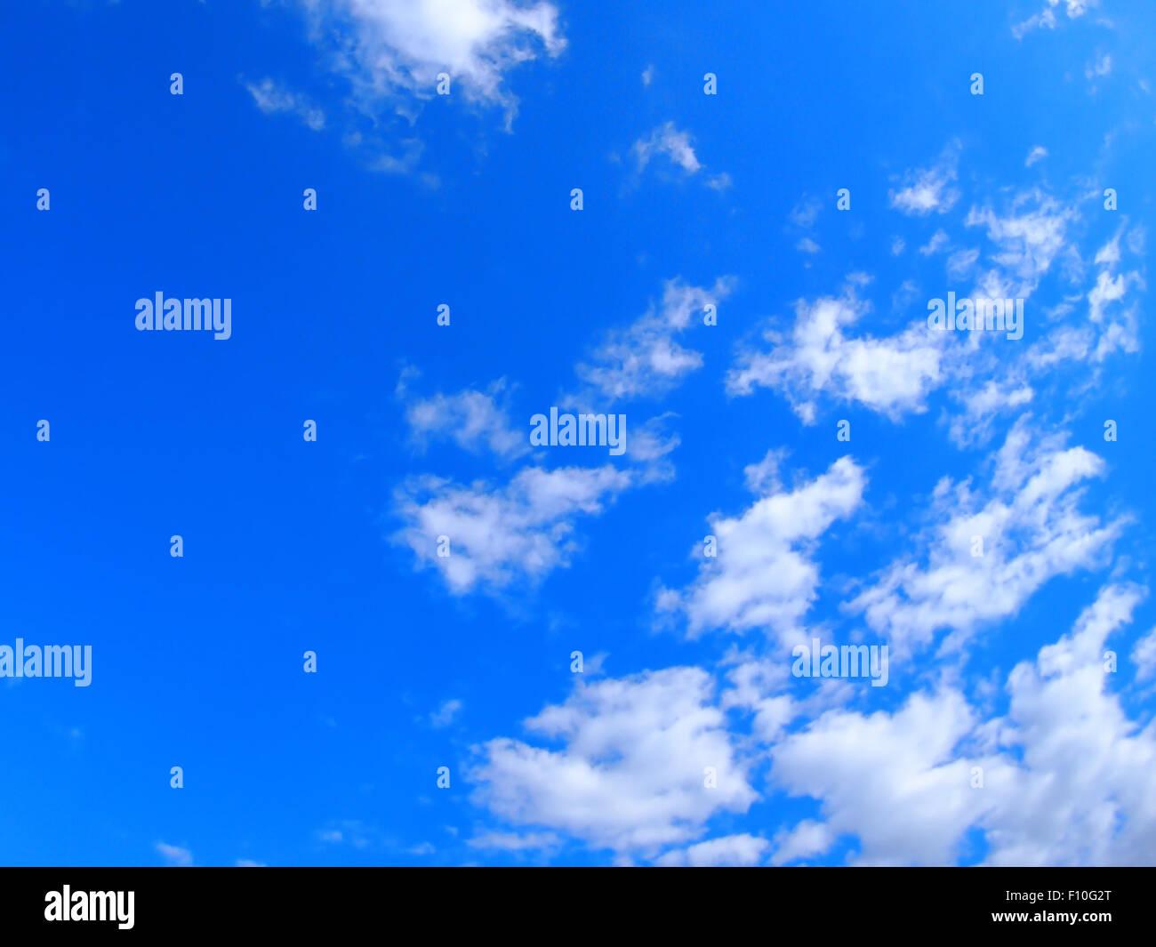 Blue sky with white fluffy clouds hi-res stock photography and images ...